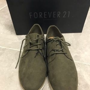 NEVER WORN Faux suede oxfords with lace up front.